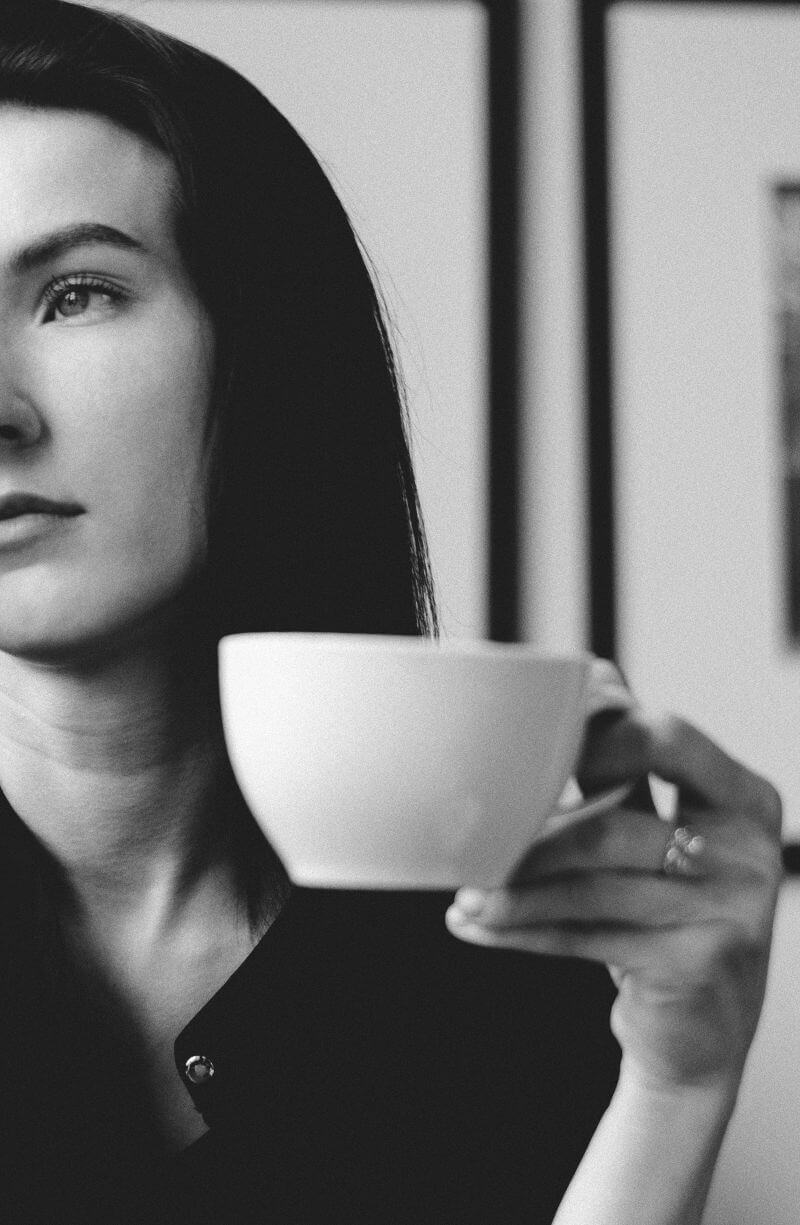 Image: A person in deep, focused contemplation — perhaps gazing thoughtfully or in a peaceful thinking pose.